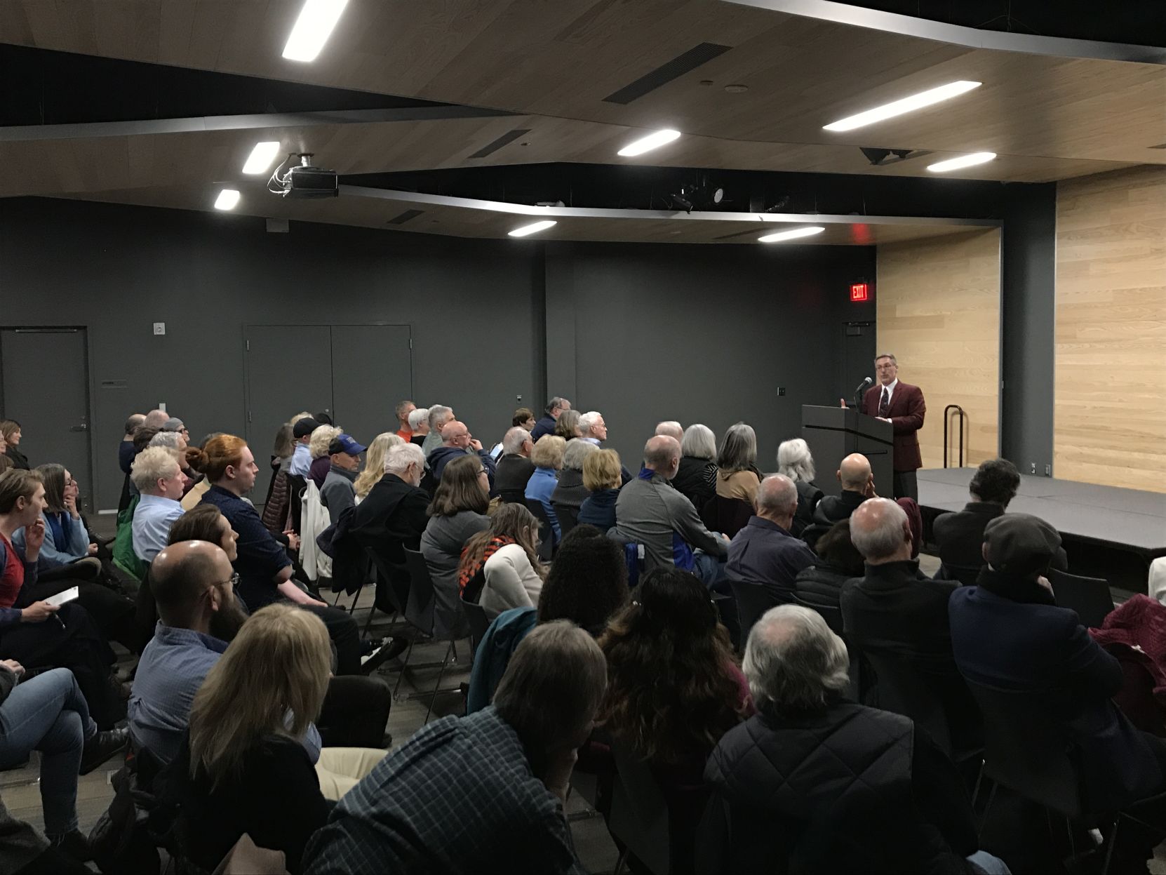 Richard Godbeer lectures in front of a crowd of roughly 30 people at the Lawrence Public Library